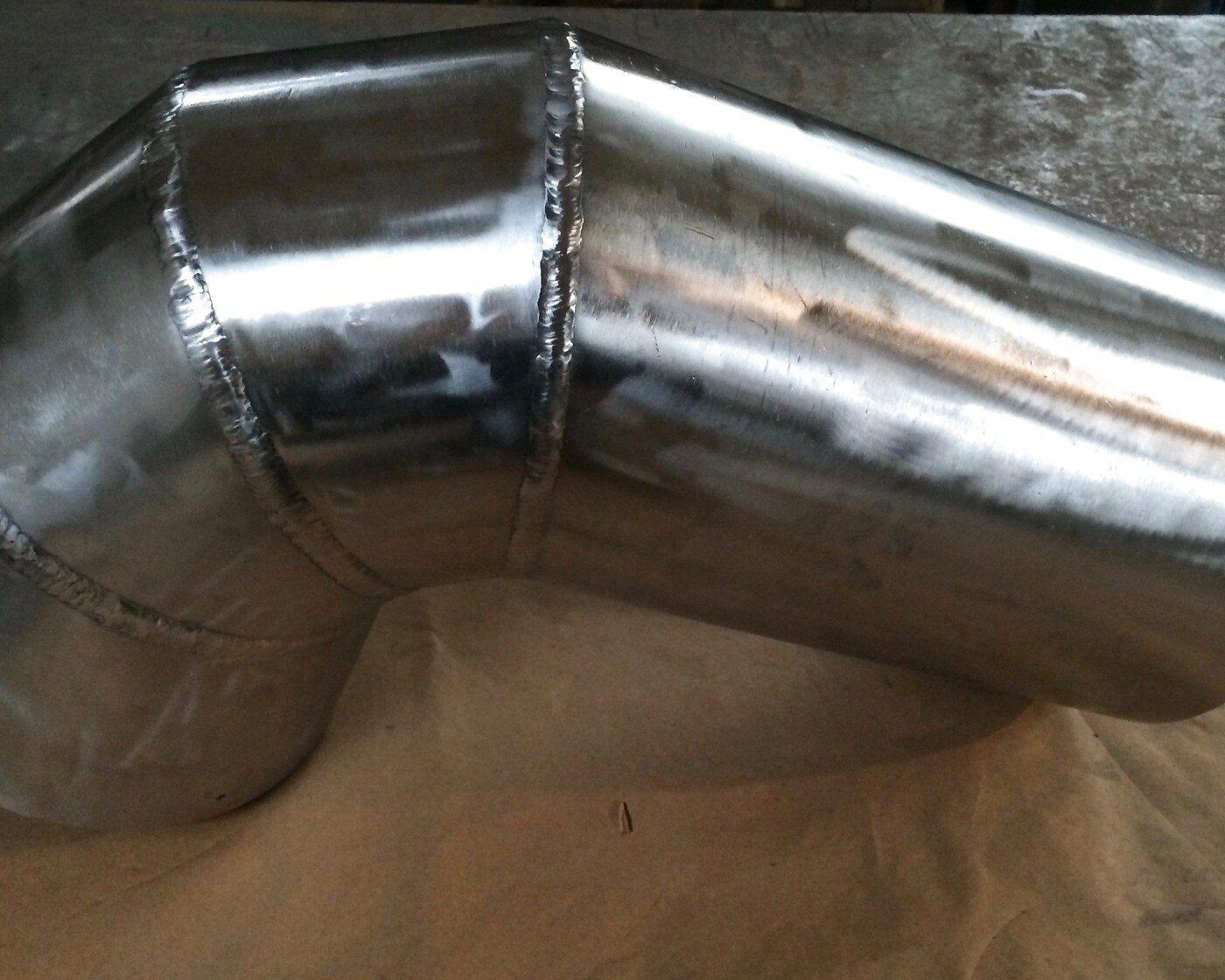 Welded stainless-steel elbow duct for oil and gas