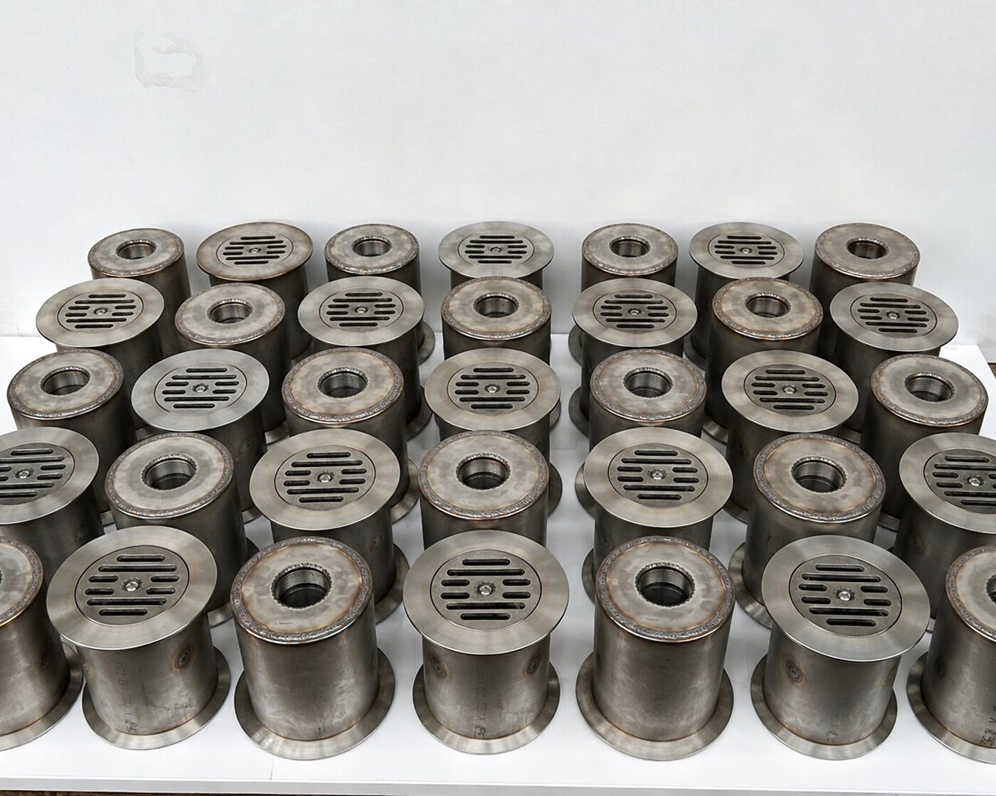 Stainless-steel drain and clean-out fittings with strainers