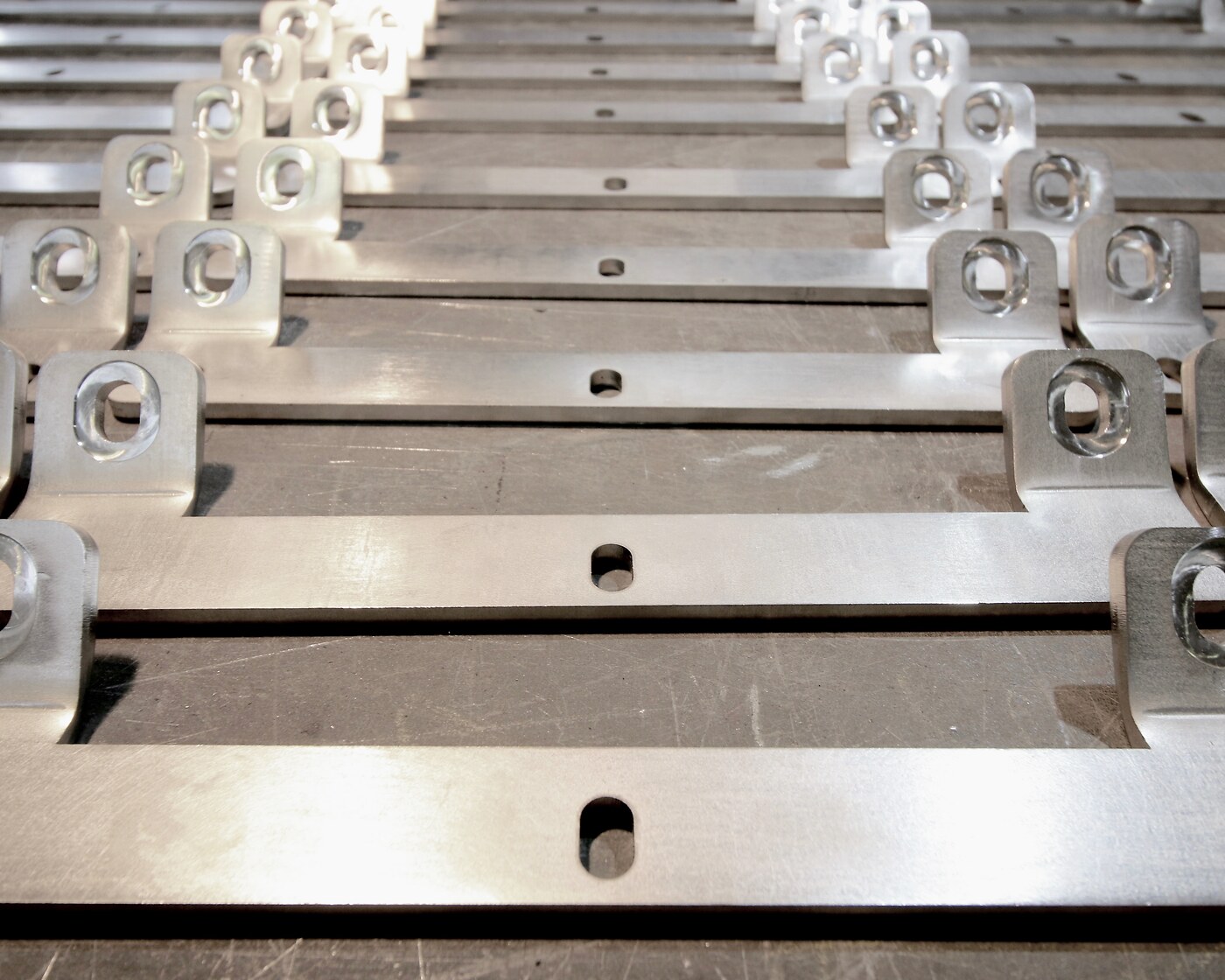 Serial stainless-steel bent bars with holes